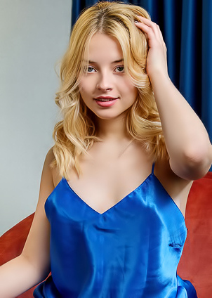 Bianca Bell Teases With Unbuttoned Chemise Lounging On Armchair